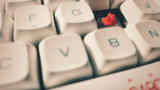 white computer keyboard showing letter b
