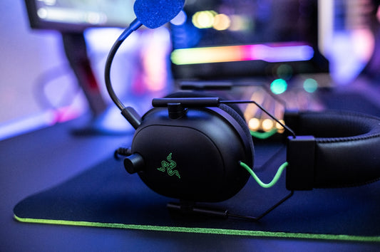 a close up of a gaming headset on a mouse pad
