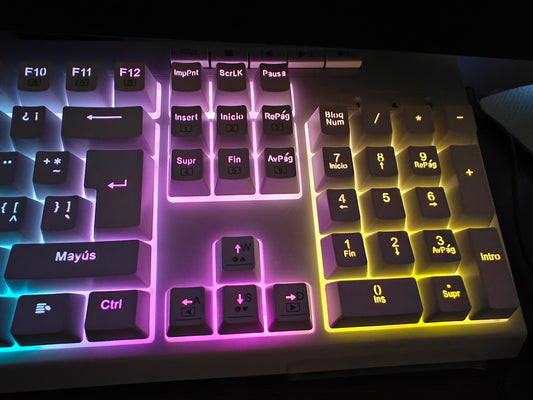 A colorful illuminated computer keyboard with rgb lighting.